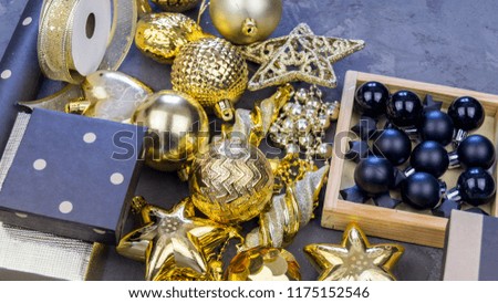 Flat Lay Christmas or Party Background with New Year gift wrapping boxs, Ribbons, Decorations in Gold and Black colors. Flat lay, top view