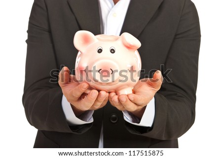 Close up of piggy bank in business man hands isolated on white background