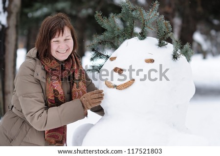 Happy middle age woman having fun in winter
