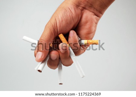 Male hand crushing cigarette, Concept Quitting smoking,World No Tobacco Day