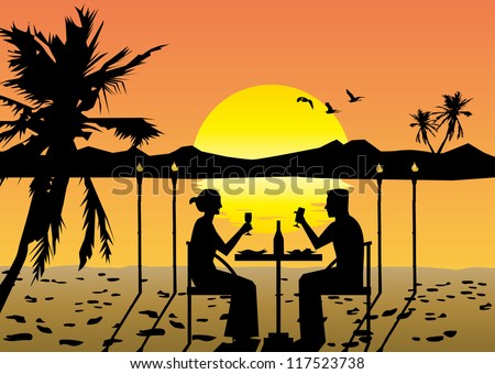 a couple dining on the beach at sunset