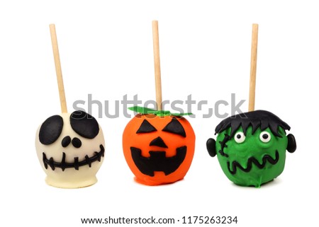 Three Halloween candy apples isolated on a white background. Skeleton, jack o lantern and monster.