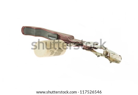 old bottle opener on a white background
