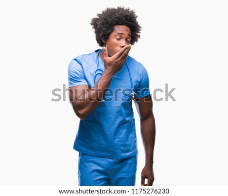 Afro american surgeon doctor man over isolated background bored yawning tired covering mouth with hand. Restless and sleepiness.