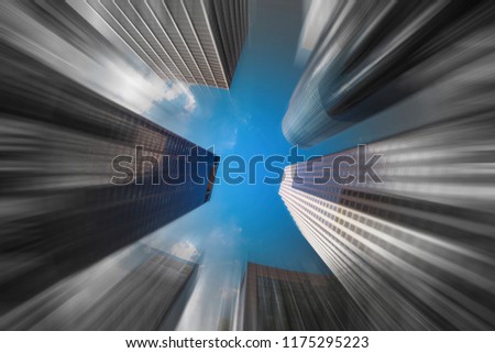 Modern downtown skyscrapers with a motion blur effect.