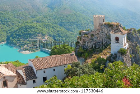The famous Bell Tower and Gateway at Guadalest near Benidorm in Spain, horizontal Royalty-Free Stock Photo #117530446