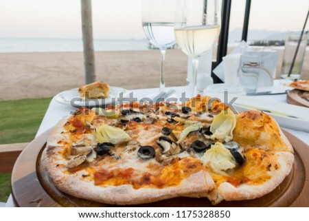 Pizza and wine. sea vacation