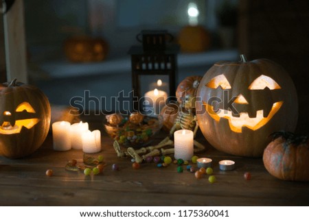 Pumpkin and candy on the table in the celebration of Halloween