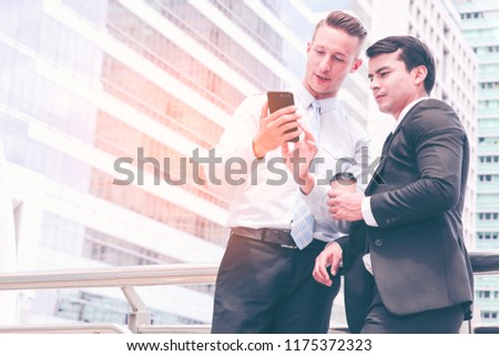 Portrait of handsome caucasian confident businessmen happy with smiling face  on city background. Succesful business teamwork concept.