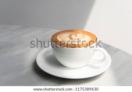 latte or Cappuccino with frothy foam, coffee cup top view on table in cafe. Royalty-Free Stock Photo #1175389630