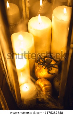 Halloween decorations on the eve of all saints' day. Candles in lanterns.