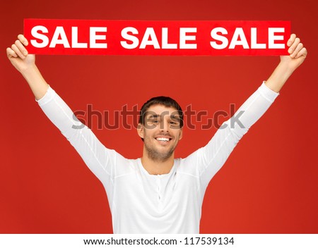 bright picture of handsome man with sale sign.