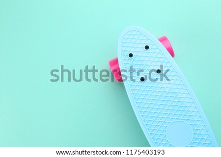 Skateboard on mint background