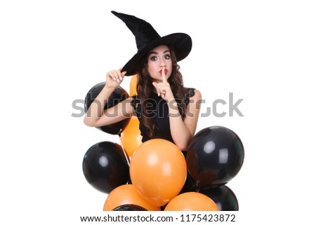 Young woman in halloween costume with balloons isolated on white background