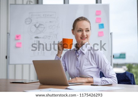 business woman holding and enjoy coffee cup  sitting at working place on White board background 