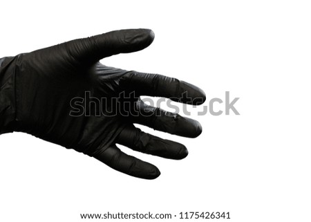 Left hand in black glove on white background. Isolated. Copy space.