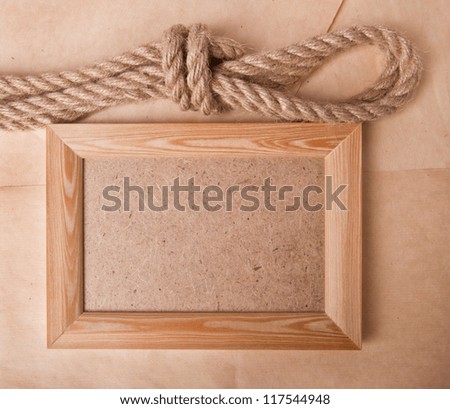 old photo frame and marine rope
