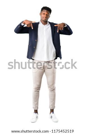 Full body of Handsome african american man wearing a jacket pointing down with fingers on white background