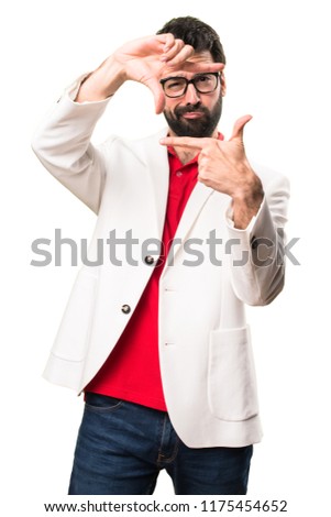 Brunette man with glasses focusing with his fingers on white background