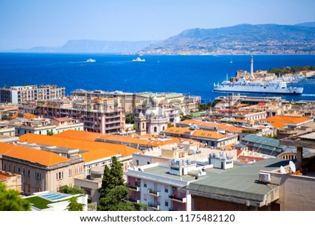 Panoramic top view of the strait and coasts of Messina with statue of 
Madonna of the Letter and Calabria, Sicily, Italy