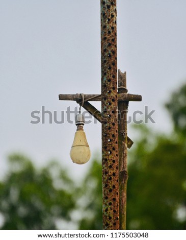 An old lamp hanging with a lamppost isolated unique photo