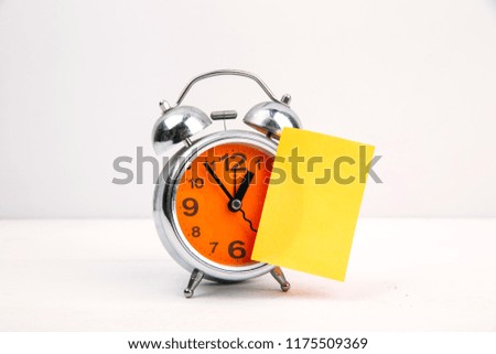 alarm clock with blank note. copy space for text 