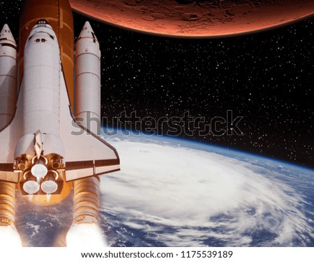 Rocket flies from earth to Mars. The elements of this image furnished by NASA.
