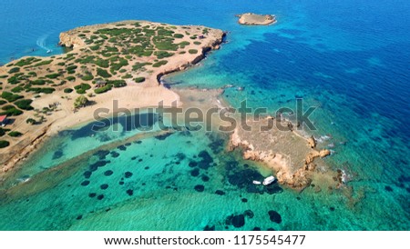 Aerial bird's eye top view photo taken by drone of tropical island seascape and sandy beach with turquoise clear waters