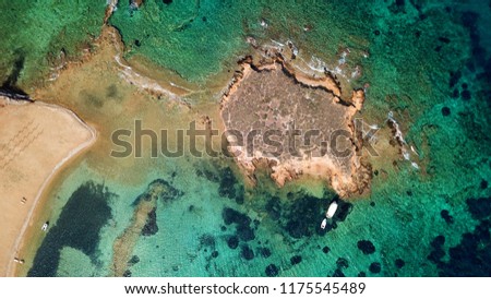 Aerial bird's eye top view photo taken by drone of tropical island seascape and sandy beach with turquoise clear waters