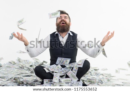 Businessman throwing dollars. Dollars raining. Millionaire man. Richness&wealth concept. Successful entrepreneur wasting money. Banker increase profit. Lottery jackpot. Happy bearded man throws money.