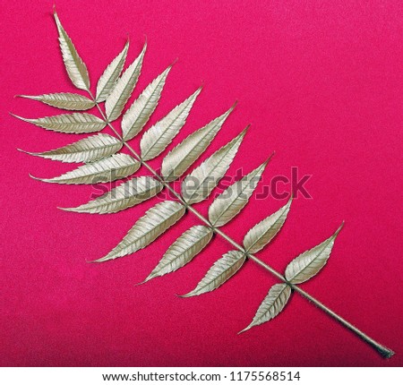  yellow gold leaf on red background