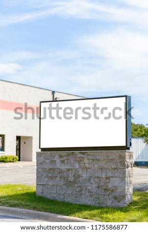 Blank advertisement board seen from street. Commercial building with copy space sign.
