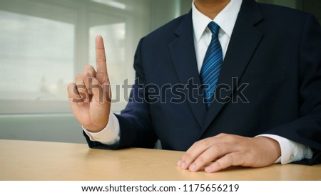Businessman showing stop hand sign