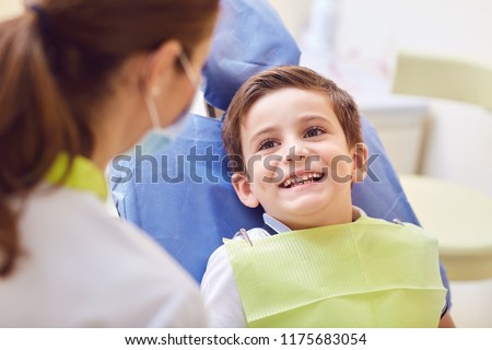 A child with a dentist in a dental office.  Royalty-Free Stock Photo #1175683054