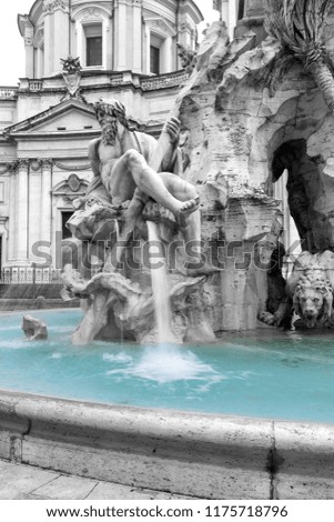 Black and white photo with color splash effect of the Fountain of the Four Rivers in the Piazza Navona (Navona Square) in Rome was designed in 1651 by Gian Lorenzo Bernini. Italy