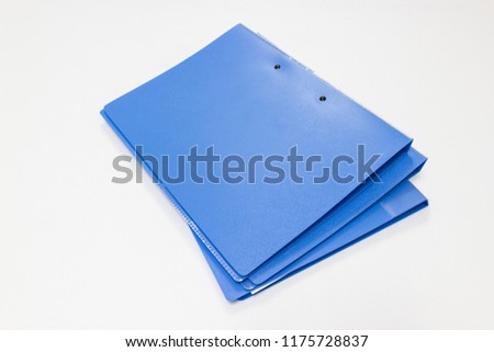 blue files folder retention of contracts and paper on white table in office, , concept Office supplies