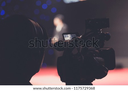 cameraman in a seminar room