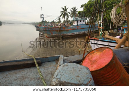 Anchored trawlers at candolim beach Goa India
