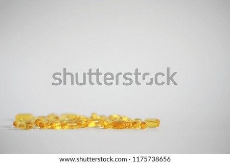 Medical medicines and supplements transparent capsules of yellow color
