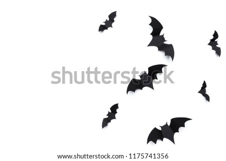 halloween and decoration concept - paper bats flying