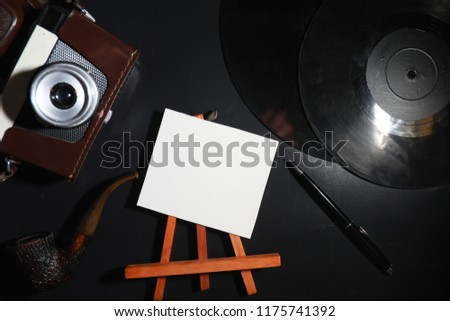 Vinyl plate and retro camera on the table
