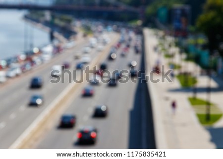Blurred abstract background of traffic cars on the multi lane highway during rush hour
