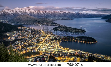 Aerial view of twilight Queenstown. Suitable for tour image. This is the most popular and famous tourist destination and attraction in New Zealand. This image is taken from hill top. Royalty-Free Stock Photo #1175840716