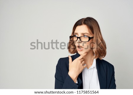 the woman with glasses looks puzzled aside                             
