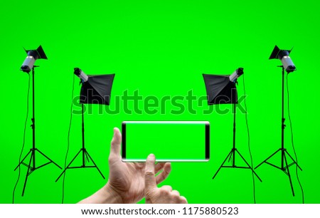 Studio lighting equipment isolated on Green background with clipping path