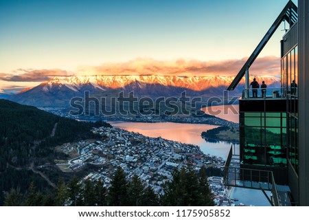 Aerial view of twilight Queenstown. Suitable for tour image. This is the most popular and famous tourist destination and attraction in New Zealand. This image is taken from hill top. Royalty-Free Stock Photo #1175905852