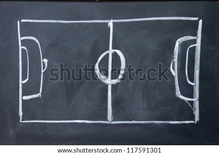 abstract football field drawn with chalk on blackboard