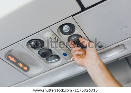 Console of the passenger on the plane. Saloon aircraft economy class. Cheap passenger transportation.