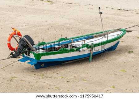 wooden fishing boat anchored