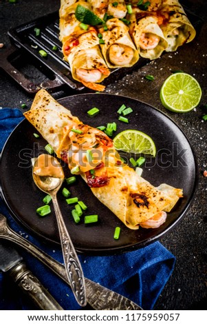 Mexican latin american food, Baked Roasted Shrimp Enchiladas with Jalapeno and Lime Cream Sauce